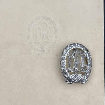  Немецкий имперский знак отличия за физическую подготовку "DRL" образца 1937 года в серебре. [WERNSTEIN] D.R.G.M.. Комплект с документом. 